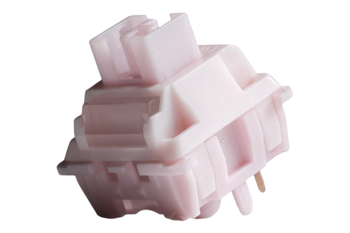Huano Sakura V2 linear switch in pastel pink, angled front view with stem and gold pins