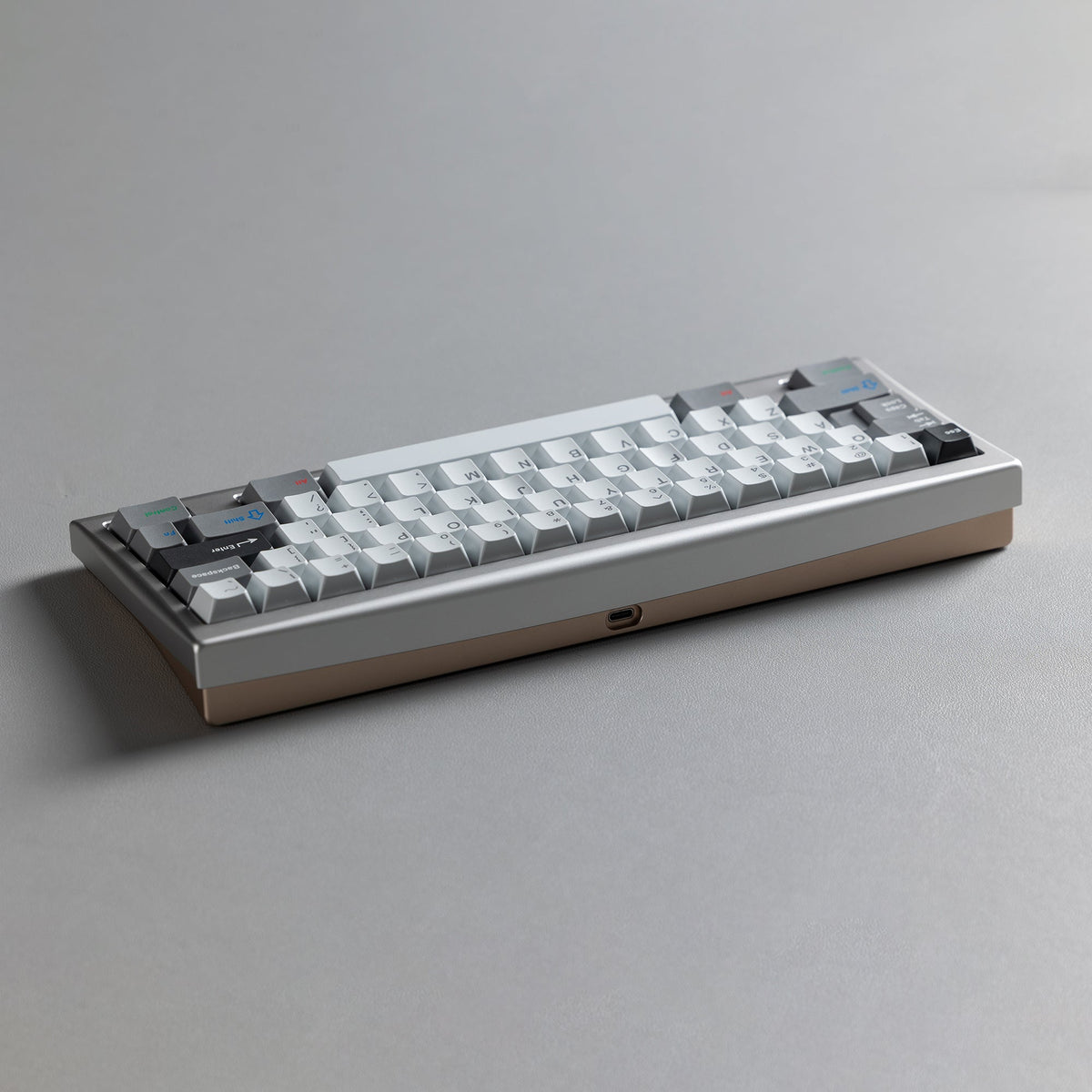 KBDFans KO-Onibi 60% keyboard kit, angled front view with a silver top case and light grey keycaps