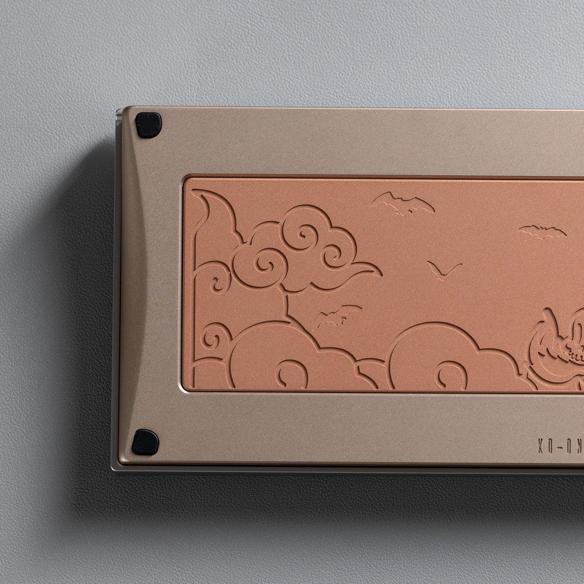 KBDFans KO-Onibi 60% keyboard kit, bottom panel from an angle with the cloud motif