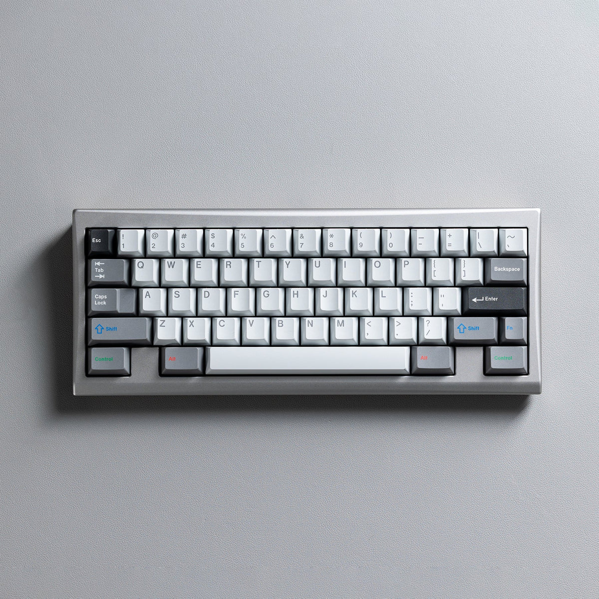 KBDFans KO-Onibi 60% keyboard kit with a silver case and light grey keycaps, top view