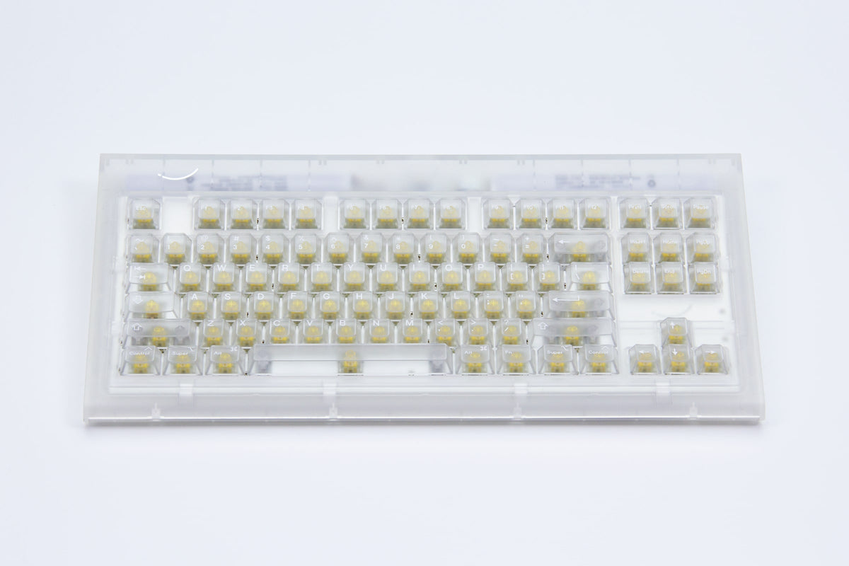 Smurve80 Lume Edition First Light front view: frosted clear case, clear keycaps, yellow switches, ANSI