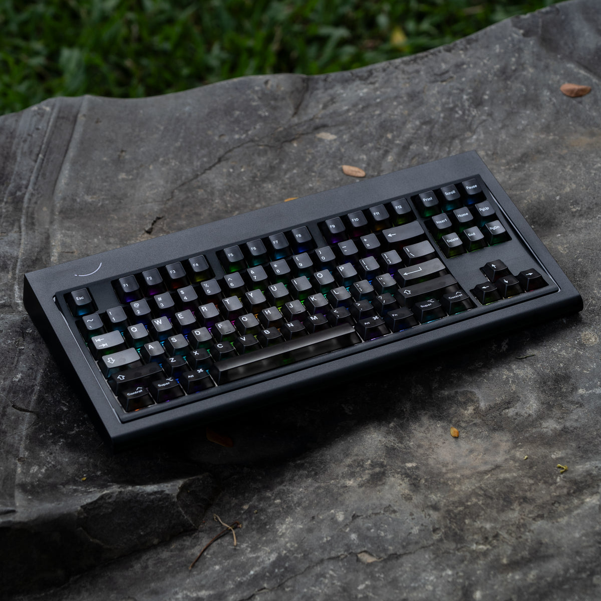 Smurve80 Lume Edition R2 in Last Night with black keycaps on a rock outdoors