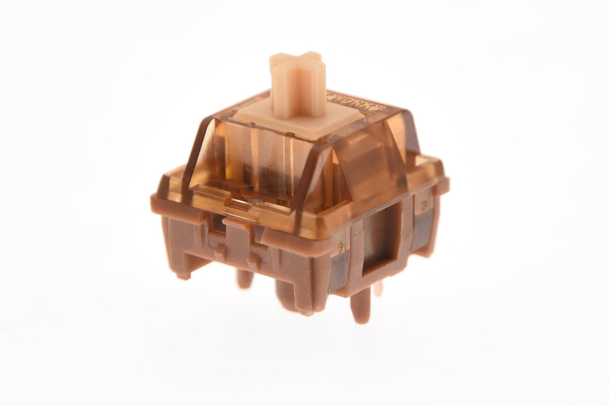 HMX Hazelnut V2 Linear Switch mit transparent braunem Top-Housing, beigem Stem und braunem Bottom-Housing