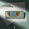 PBS Kids Typewriter Keycaps, colorful keycaps in green, red, blue and yellow on a mint green case, top view on letter paper